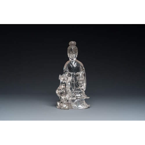 711 - A Chinese rock crystal sculpture of Lan Caihe on wooden stand, 19th C.H.: 32 cm (incl. stand)H.: 27 ... 