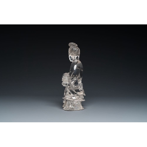 711 - A Chinese rock crystal sculpture of Lan Caihe on wooden stand, 19th C.H.: 32 cm (incl. stand)H.: 27 ... 