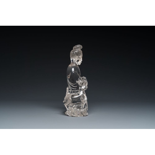 711 - A Chinese rock crystal sculpture of Lan Caihe on wooden stand, 19th C.H.: 32 cm (incl. stand)H.: 27 ... 