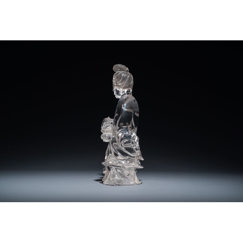 711 - A Chinese rock crystal sculpture of Lan Caihe on wooden stand, 19th C.H.: 32 cm (incl. stand)H.: 27 ... 