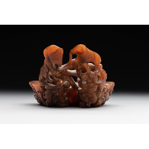 715 - A rare Chinese carved rhinoceros horn 'libation cup' with grape design, 17/18th C.Dim.: 11,5 x 6 x 4... 