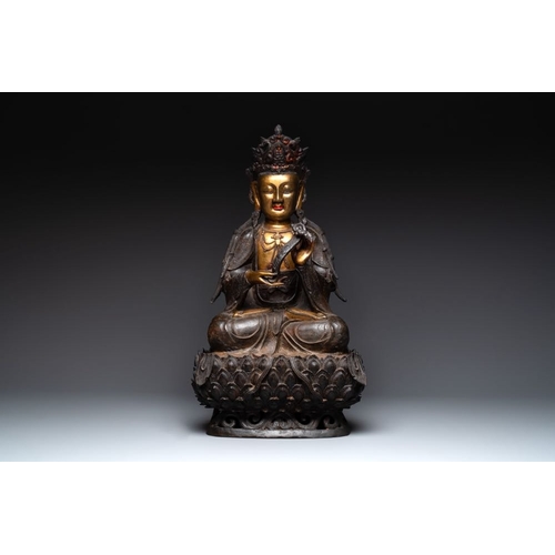 721 - An impressive and large Chinese partially lacquered and gilt bronze Guanyin on a lotus throne, MingH... 