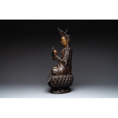 721 - An impressive and large Chinese partially lacquered and gilt bronze Guanyin on a lotus throne, MingH... 