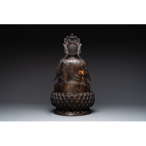 721 - An impressive and large Chinese partially lacquered and gilt bronze Guanyin on a lotus throne, MingH... 