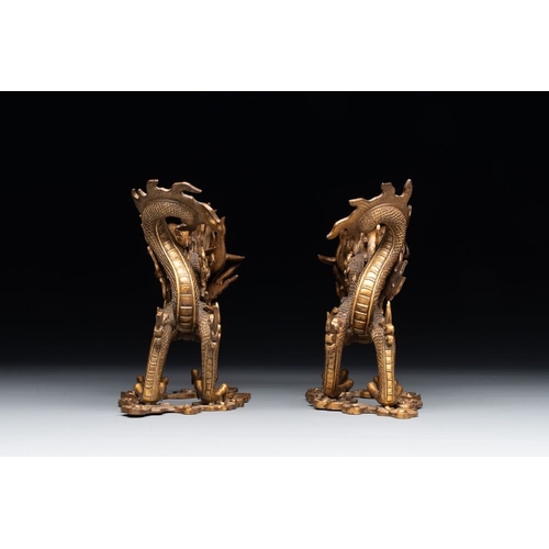 740 - A pair of Chinese gilt bronze dragons among flames and clouds, 19/20th C.L.: 17,8 cm - H.: 13,5 cm
W... 