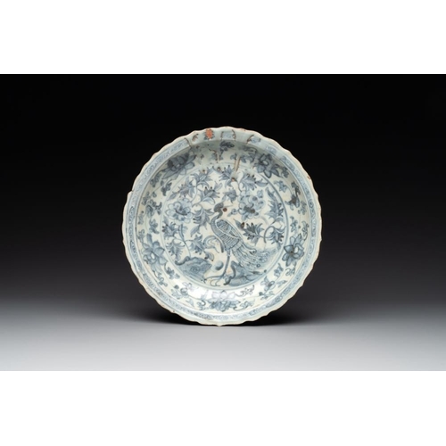 77 - A Chinese blue and white 'phoenix' dish and two 'Buddhist lion' and 'peony' plates, Hongzhi/ZhengdeD... 