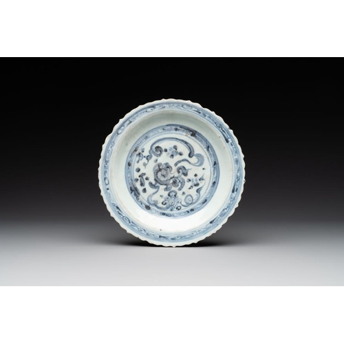 77 - A Chinese blue and white 'phoenix' dish and two 'Buddhist lion' and 'peony' plates, Hongzhi/ZhengdeD... 