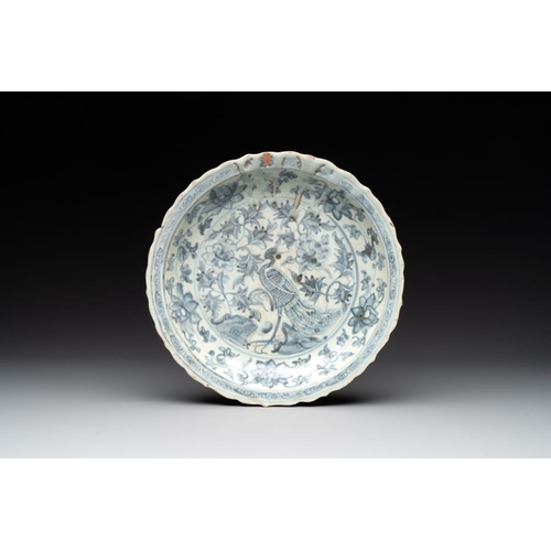 77 - A Chinese blue and white 'phoenix' dish and two 'Buddhist lion' and 'peony' plates, Hongzhi/ZhengdeD... 