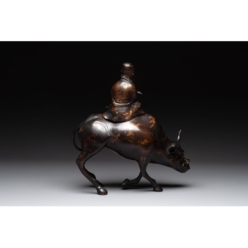 795 - A Chinese gold-splashed bronze incense burner in the shape of an immortal riding a buffalo, 19th C.D... 