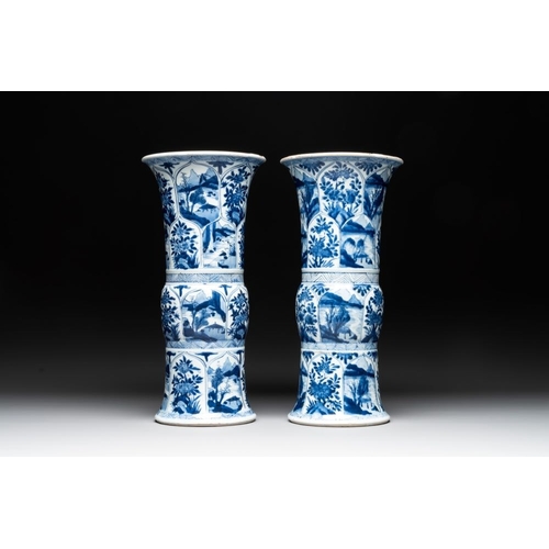 907 - Two Chinese blue and white 'gu' vases with landscape and floral panels, KangxiH.: 34 cm... 