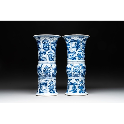 907 - Two Chinese blue and white 'gu' vases with landscape and floral panels, KangxiH.: 34 cm... 