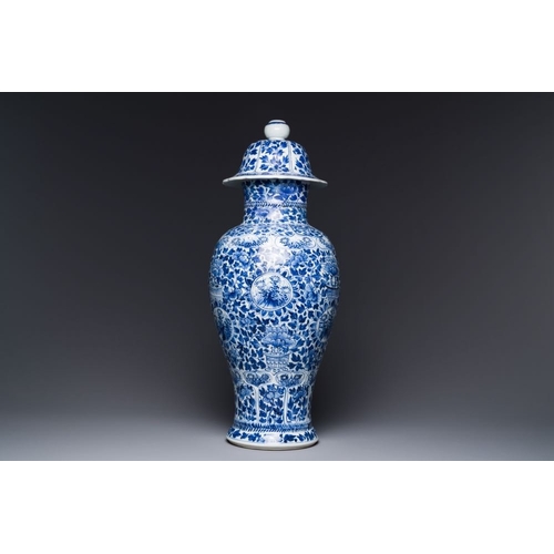 908 - A Chinese blue and white vase and cover with floral design, KangxiH.: 52 cm