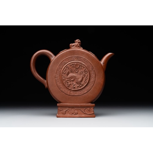 978 - A Chinese circle-shaped  Yixing stoneware 'kylin' teapot with relief design, KangxiL.: 16 cm - H.: 1... 