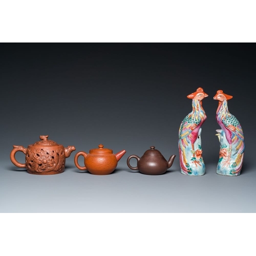 981 - Three Chinese Yixing stoneware teapots and a pair of famille rose phoenixes, 19/20th C.H.: 21 cm (th... 