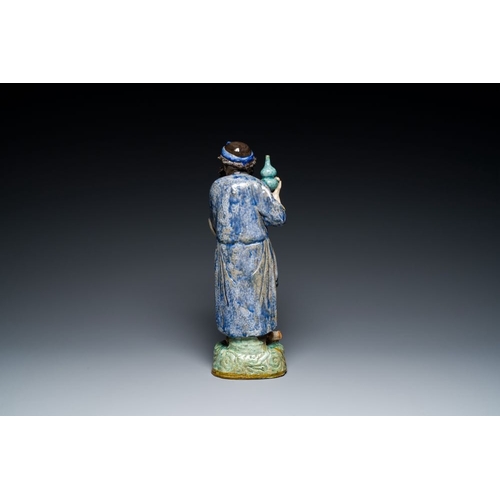 986 - A large Chinese polychrome Shiwan pottery figure of Li Tieguai, 19th C.H.: 41 cm