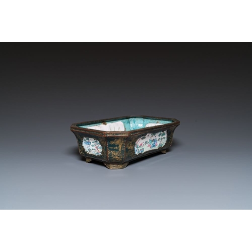 809 - A Chinese Canton enamel gilt-decorated dark-green-ground jardiniere with four inserted plaques, Qian... 