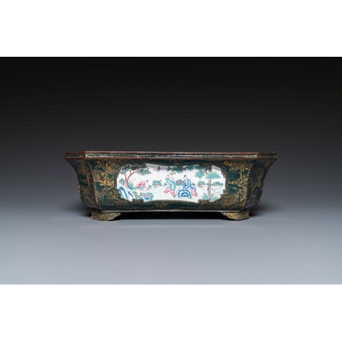 809 - A Chinese Canton enamel gilt-decorated dark-green-ground jardiniere with four inserted plaques, Qian... 