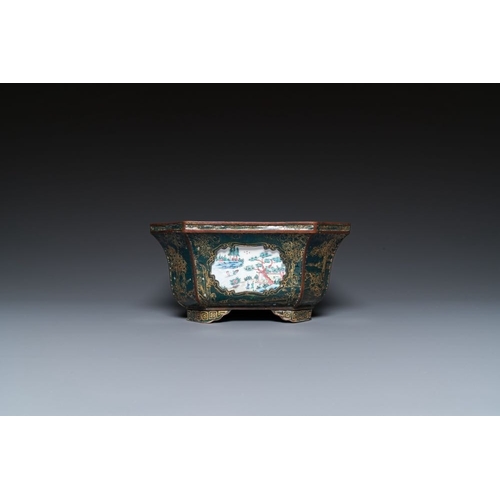 809 - A Chinese Canton enamel gilt-decorated dark-green-ground jardiniere with four inserted plaques, Qian... 