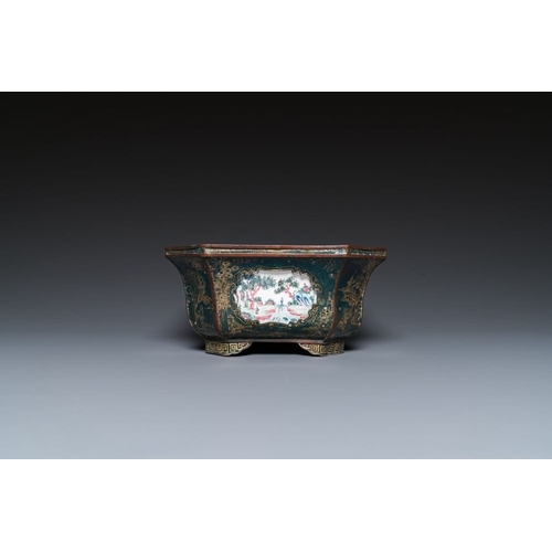 809 - A Chinese Canton enamel gilt-decorated dark-green-ground jardiniere with four inserted plaques, Qian... 