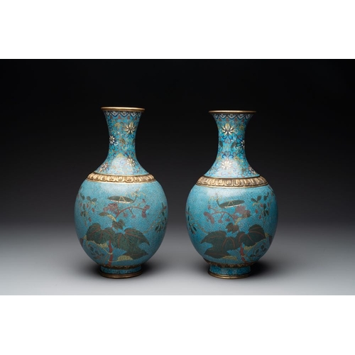 834 - A pair of Chinese cloisonne 'flowers and insects' vases on wooden stands, 18/19th C.H.: 40,5 cm (inc... 