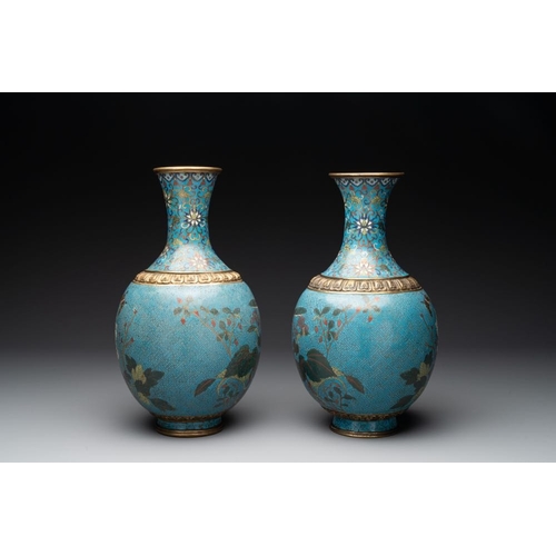 834 - A pair of Chinese cloisonne 'flowers and insects' vases on wooden stands, 18/19th C.H.: 40,5 cm (inc... 