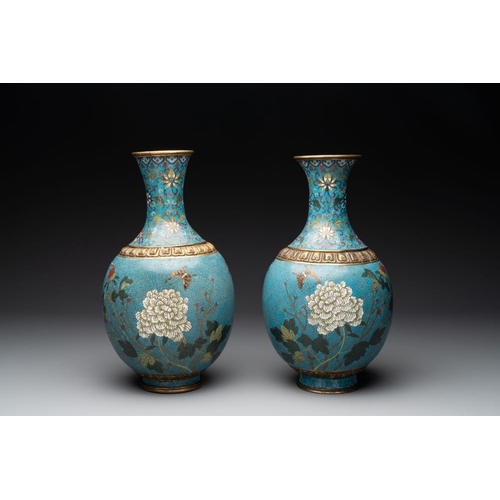 834 - A pair of Chinese cloisonne 'flowers and insects' vases on wooden stands, 18/19th C.H.: 40,5 cm (inc... 