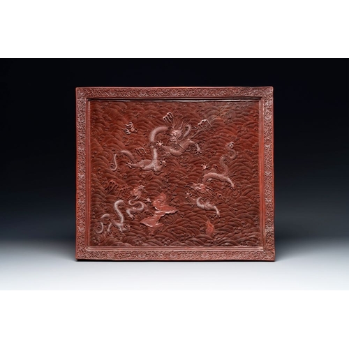 852 - A rectangular Chinese carved red lacquer 'dragon' table screen, later wooden stand, QianlongDim.: 59... 