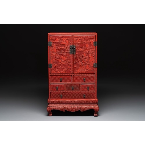 854 - A Chinese cinnabar lacquer 'mountainous landscape' cabinet on a stand, 19th C.Dim.: 44 x 24 x 70,5 c... 