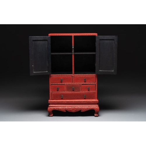 854 - A Chinese cinnabar lacquer 'mountainous landscape' cabinet on a stand, 19th C.Dim.: 44 x 24 x 70,5 c... 