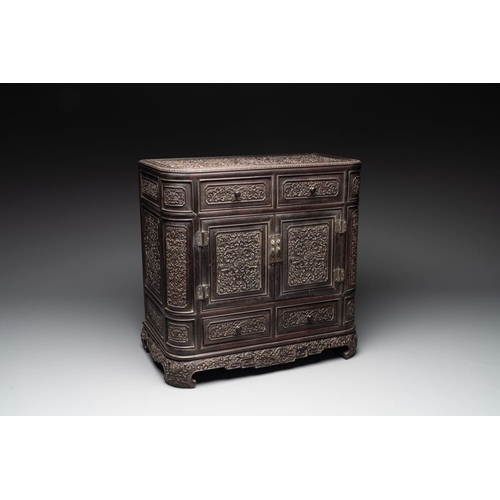 855 - A Chinese zitan wood 'duo bao ge' cabinet of curiosities with carved floral design, 19th C.Dim.: 48,... 