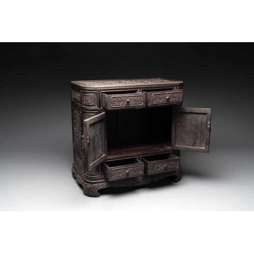 855 - A Chinese zitan wood 'duo bao ge' cabinet of curiosities with carved floral design, 19th C.Dim.: 48,... 