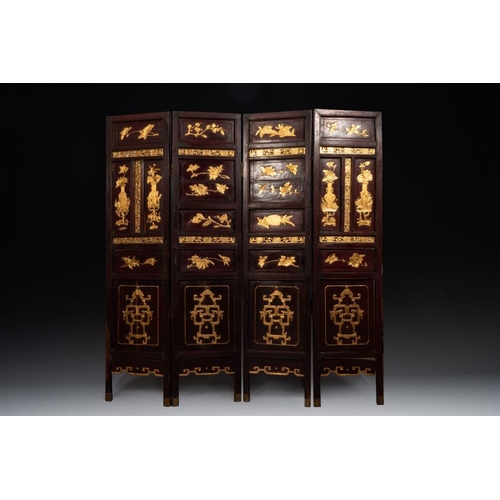 859 - A Chinese four-part reticulated and partially gilt wooden folding screen, 19th C.Dim.: 200 x 195 cm ... 