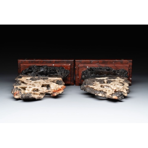 860 - A pair of Chinese carved soapstone groups and a painted alabaster and wood table screen depicting a ... 