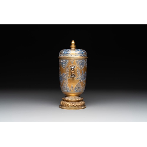 892 - A Chinese gilt-ground blue and white lidded beaker on a French gilt bronze foot, KangxiH.: 21,5 cm (... 