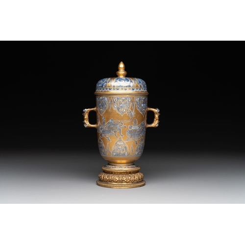 892 - A Chinese gilt-ground blue and white lidded beaker on a French gilt bronze foot, KangxiH.: 21,5 cm (... 