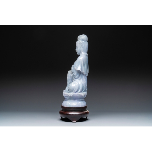 712 - An exceptional and large Chinese carved pale lavender jadeite Guanyin on a wooden stand, RepublicH.:... 