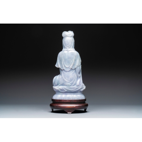 712 - An exceptional and large Chinese carved pale lavender jadeite Guanyin on a wooden stand, RepublicH.:... 