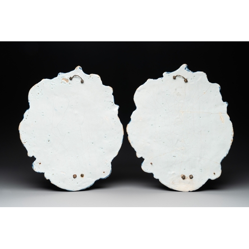 1018 - A pair of polychrome Dutch Delft plaques mounted as wall sconces with silver mounts, 18th C.Dim.: 35... 