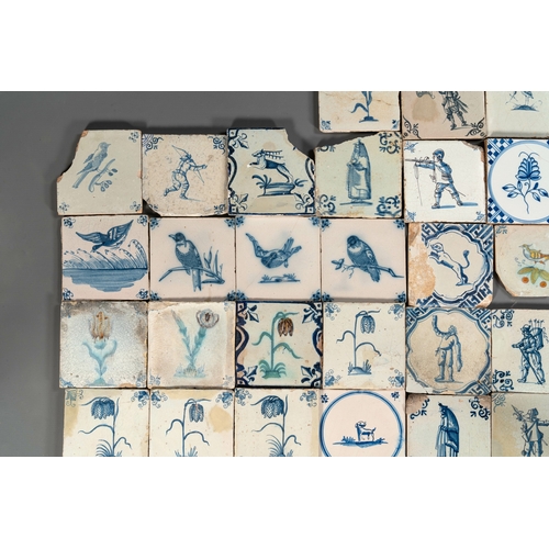 1077 - 105 polychrome, blue and white Dutch Delft tiles with figures, flowers and animals, 17/18th C.Dim.: ... 