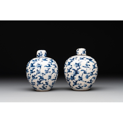 21 - A pair of Chinese blue and white soft paste '100 boys' covered jarlets and a seal paste box, Kangxi ... 