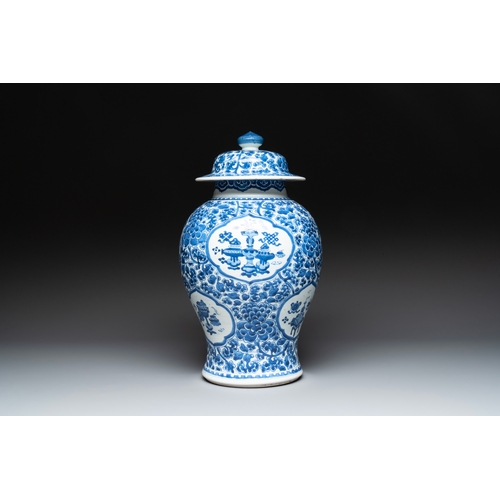 281 - A Chinese blue and white 'antiquities and peony scrolls' vase and cover, KangxiH.: 45 cm (incl. cove... 