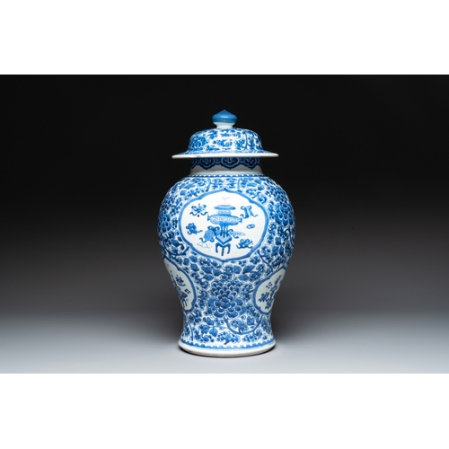 281 - A Chinese blue and white 'antiquities and peony scrolls' vase and cover, KangxiH.: 45 cm (incl. cove... 