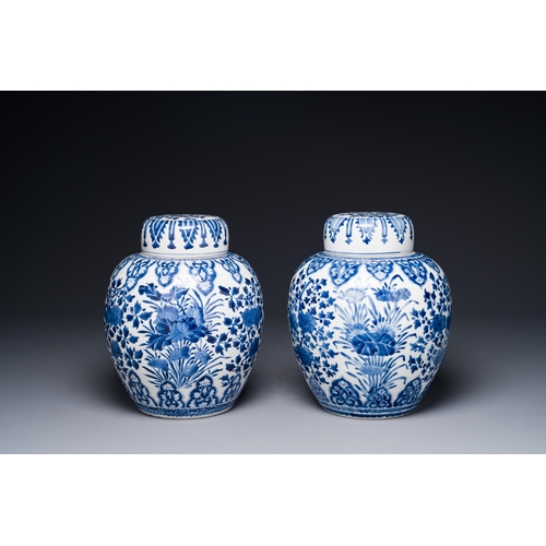 283 - A pair of Chinese blue and white ginger jars and covers with floral design, KangxiH.: 28 cm (incl. c... 