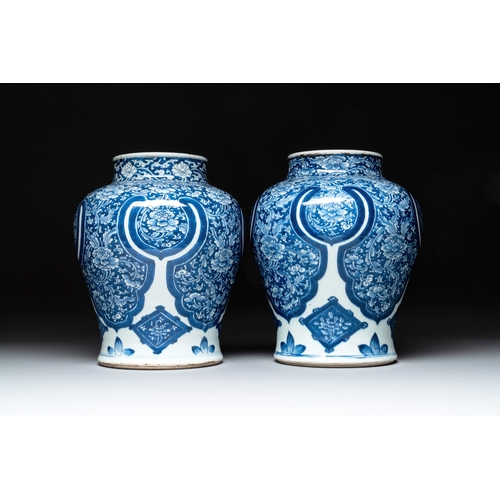 284 - A pair of Chinese blue and white 'peony scroll' vases, KangxiH.: 30,5 cm