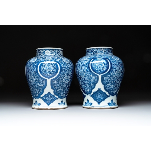 284 - A pair of Chinese blue and white 'peony scroll' vases, KangxiH.: 30,5 cm