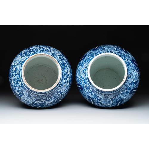 284 - A pair of Chinese blue and white 'peony scroll' vases, KangxiH.: 30,5 cm