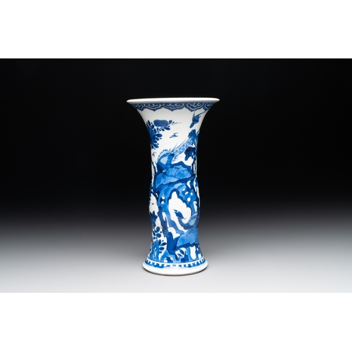 285 - A Chinese blue and white 'gu' vase with birds amongst flowering branches, KangxiH.: 24,5 cm... 