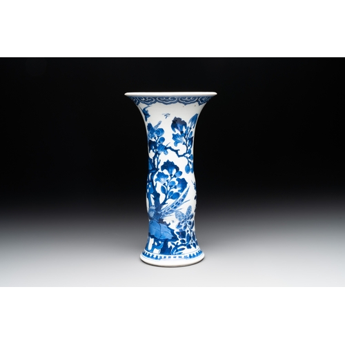 285 - A Chinese blue and white 'gu' vase with birds amongst flowering branches, KangxiH.: 24,5 cm... 