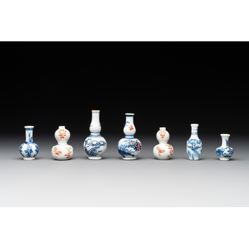 326 - Seven Chinese iron-red, blue and white miniature vases, KangxiH.: 7,2 cm (the tallest) H.: 3,7 cm (t... 