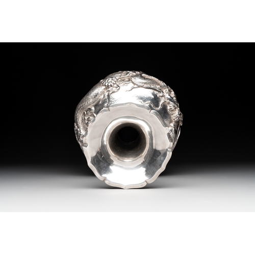 466 - A Japanese silver 'dragon' vase, signed Mitsuhisa, Meiji, 19th C.H.: 28 cm
Weight: 622 grams
The bot... 